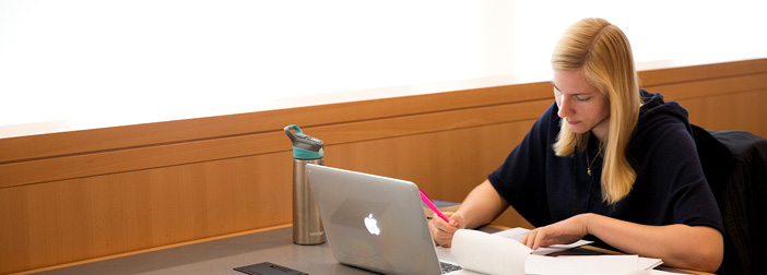 female student writing