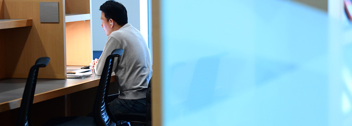 male student in study carrel