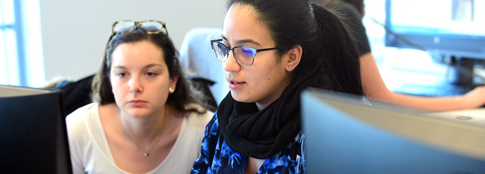 two female students looking at monitor
