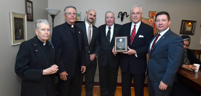 (L-R) Daniel Sullivan, S.J. professor of biology; Alumni Chaplain Daniel J. Gatti, S.J.; PCS student Kevin Knightes, president of Fordham Veterans Association; (Retired) Col. Edward Winkler, FCRH '67, LAW '72, Hall of Fame Inductee Thomas W. Hyland, FCRH '65, LAW '71; and (Retired) Master Sergeant Matthew Butler, PCS '16, director of Military and Veterans' Services at Fordham.