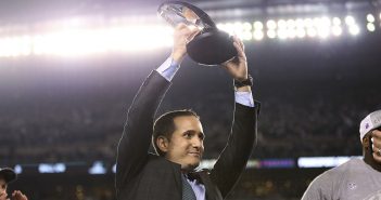 Howie Roseman, Philadelphia Eagles executive vice president of football operations, lifts the NFC championship trophy after the Eagles' 38-7 win over the Minnesota Vikings during the NFC championship NFL football game Sunday, Jan. 21, 2018, in Philadelphia. (David Maialetti/The Philadelphia Inquirer via AP)