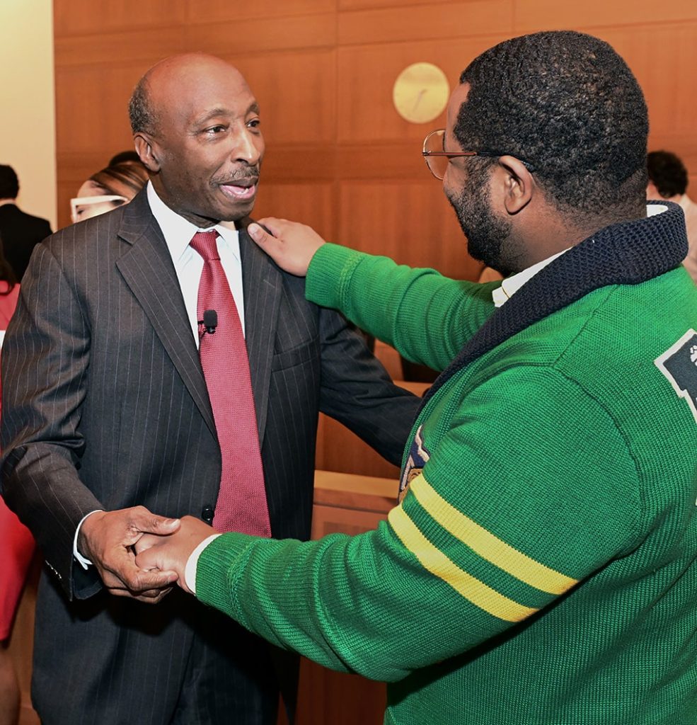 Ken Frazier greets Steven McFarland ’24, an alum of Cornerstone Christian Academy in Philadelphia, Penn. (founded by Frazier), who was inspired by Frazier's example to attend law school.