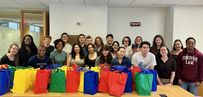 Fordham Law students pose with care packages during Public Service Day events
